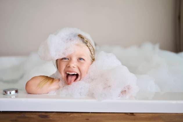 Playful girl covered in soap suds and sticking out tongue model released, Symbolfoto property released, ANNF00616