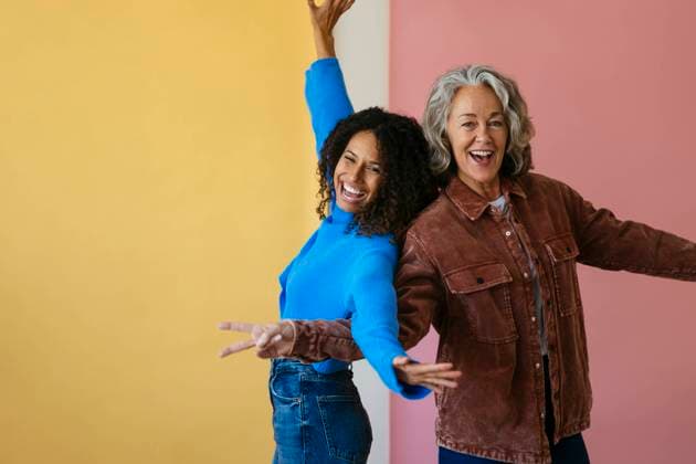 Happy mother and daughter having fun against colored background model released, Symbolfoto, EBSF04041