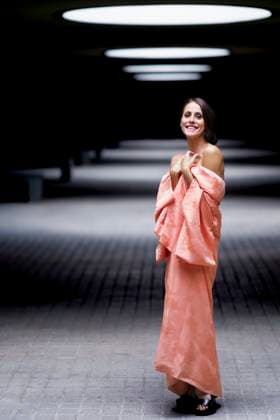 Creative Highlights Symbolbilder Smiling woman wearing kimono and standing under spotlight model released, Symbolfoto, JSMF02936