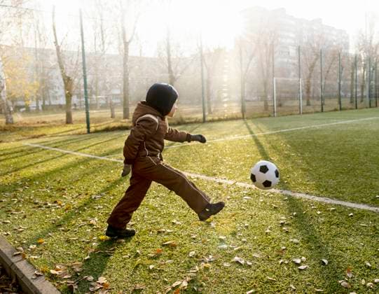 Creative Highlights Symbolbilder Boy kicking ball at soccer field model released, Symbolfoto, MBLF00174