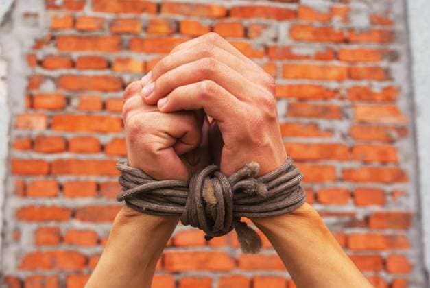 Hands tied up with rope Hands tied up with rope against brick wall ,model released, Symbolfoto Copyright: xZoonar.com AndreyxKravchenkox 4525480 ,model released, Symbolfoto ,property released