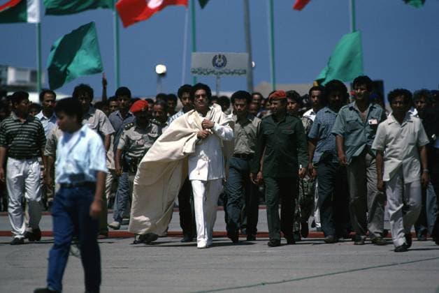 Libyan Leader Muammar Gaddafi tripoli, libya -- libyan president muamar ghaddafi with entourage at the miliary airport (ex wheelus air base) in tripoli. Tripoli Libya EDITORIAL USE ONLY Copyright: xx BarryxIversonxPhotographyx bivphotos001671