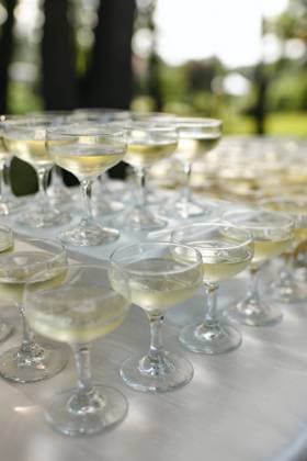 Stacked champagne glasses at an outdoor celebratory event Chicago, Illinois, United States R_AKAO2312293B-1312652-01
