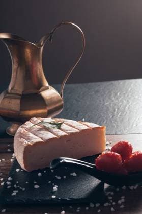 A closeup of the traditional French Brie cheese with red tomatoes 1188622 RECORD DATE NOT STATED