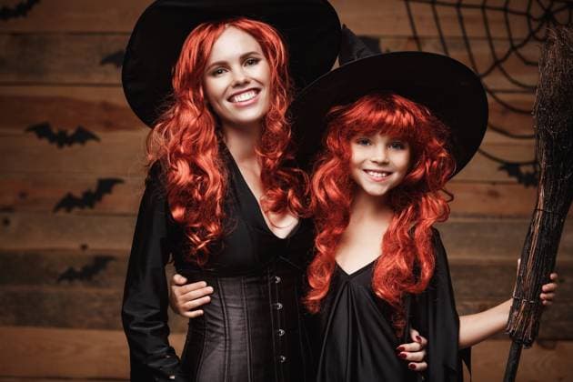 Beautiful caucasian mother and her daughter with long red hair in witch costumes celebrating Halloween posing with over bats and spider web on Wooden studio background. Halloween Concept: Beautiful caucasian mother and her daughter with long red hair in witch costumes celebrating Halloween posing with over bats and spider web on Wooden studio background ,model released, Symbolfoto Copyright: xZoonar.com PhongthornxHiranlikhitx 16935625 ,model released, Symbolfoto ,property released