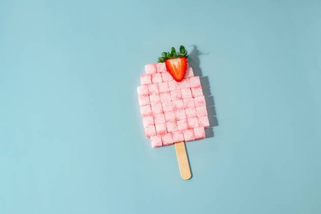 Strawberry Sugar Cube Popsicle on Blue Background CR_UUAB240107C-1301789-01