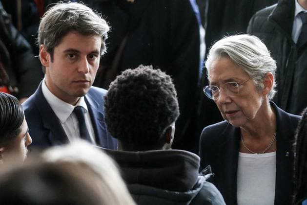 Reshuffle: Attal Could Be Named Prime Minister File photo - French Prime Minister Elisabeth Borne and French Education and Youth Minister Gabriel Attal during a tribute ceremony for slain French teachers Samuel Paty and Dominique Bernard at the Bois d Aulne college in Conflans-Sainte-Honorine, near Paris, France, on October 16, 2023. - French National Education Minister Gabriel Attal could be named Prime Minister after Elisabeth Borne spoke with President Emmanuel Macron as a cabinet reshuffle appears imminent. At 34, he could become the youngest Prime Minister of the Fifth Republic. Photo by Stephane Lemouton Pool ABACAPRESS.COM Conflans-Sainte-Honorine France  Copyright: xLemoutonxStephane Pool ABACAx