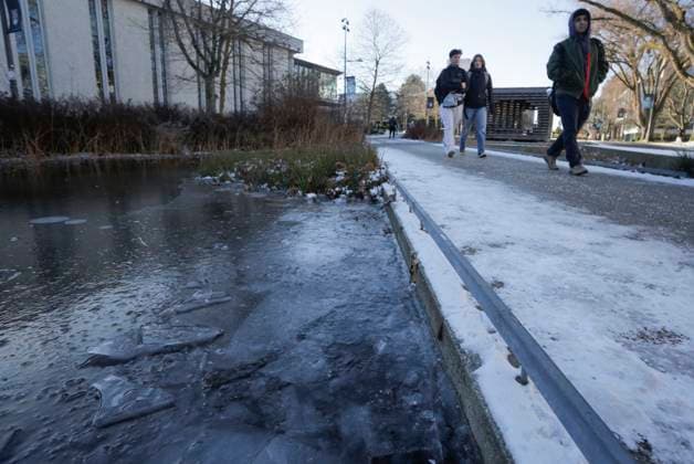 (240113) -- VANCOUVER, Jan. 13, 2024 -- Pedestrians walk on the frozen pavement at the University of British Columbia in Vancouver, British Columbia, Canada, on Jan. 12, 2024. Environment Canada issued weather warnings, statements and watches in every province and territory across the country on Friday morning. Extreme cold is an issue on the West Coast, in the Prairies and in northern Canada, where it may feel as cold as minus 55 Celsius, CTV News reported. (Photo by Xinhua) CANADA-VANCOUVER-EXTREME COLD WEATHER LiangxSen