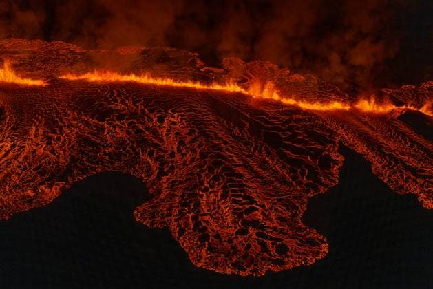 These images show volcanic fissures near the Icelandic town of Grindavik, near the capital, Reykjavik, on Sunday (14January2024). Houses have caught fire in Grindavik after the eruptions of the volcano on the Reykjanes peninsula in the early hours of Sunday. The entire population of the town has been evacuated. Lava flows breached defences built after an eruption in December and the main road into the town has been cut off by the flow of the lava. Iceland s President Gudni Johannesson urged people to stand together and have compassion for those who cannot be in their homes . Earthquakes preceded the December eruption in the Svartsengi volcanic system. The Icelandic Meteorological Office (IMO) said defensive barriers had been breached Copyright: xx 53364642