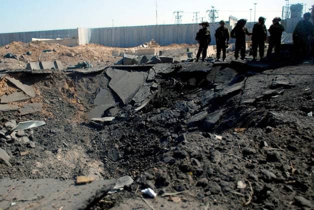 Suicide Bomber Blows Up Truck at Gaza Crossing, No Casualties Reported Damage to the separation wall by a Palestinian suicide bomber attack at Erez Crossing, Israel on Thursday May 22, 2008. A Palestinian bomber blew up an explosives-laden truck on the Palestinian side of the Erez crossing on the Israel-Gaza Strip border early Thursday morning. The driver was the only casualty in the attempted attack. The main force of the explosion took place on the Palestinian side of the border; however one house in Netiv Ha asara was reported damaged. The military was investigating the circumstances of the explosion. Islamic Jihad officials reported that one of their men was responsible for the explosion. Photo by Chameleons Eye IDF Spokesman EDITOR Copyright: xx ChameleonsxEye IDFxSpokesmanx cewitness004536