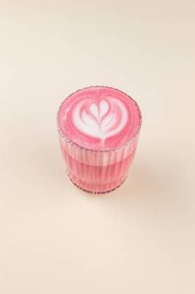 pink matcha latte on a cup on a light background R_KUAL240116-1323813-01