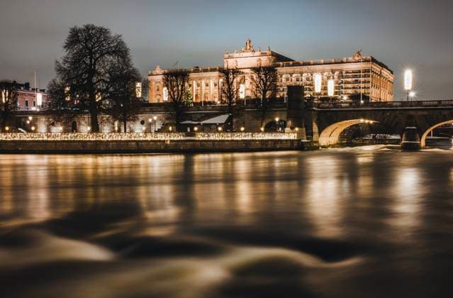 Royal palace lit up at night with river, Stockholm Sweden Stockholm, Stockholm County, Sweden R_SSNF240116-1314156-01