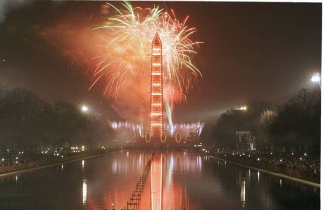 Fireworks at Washington Monument for New Millennium Washington, DC - January 1, 2000 -- The Washington Monument appears to be in flames at the stroke of midnight ushering in the new millennuim on 1 January, 2000. The green lines at the top of the frame are part of the laser light display. Credit: Ron Sachs CNP Washington District of Columbia United States of America EDITORIAL USE ONLY Copyright: xx RonxSachsx cnpphotos003876