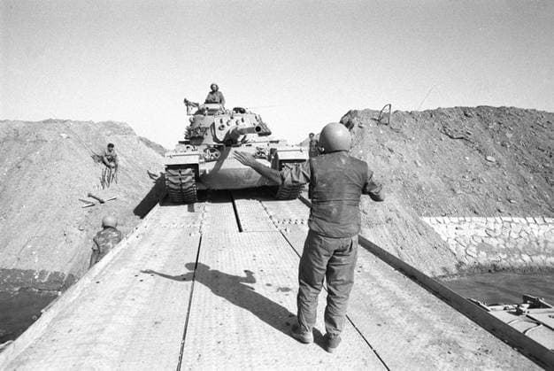 Yom Kippur War - October War Israeli Tanks Cross the Suez Canal. On the Yom Kippur of October 6, 1973, Egypt and Syria launched a coordinated surprise attack on Israel. The Yom Kippur War was launched on the holiest day on the Jewish calendar: The Day of Atonement.Using innovative tactics and advanced technology, Israeli forces achieved a remarkable military recovery--Israeli troops broke the Arab advance and encircled Egyptian forces in Sinai. Pictured here are the Israeli tanks which crossed into the Suez Canal s western border and reached within 101 kilometers of Cairo, Egypt. Photo by IDF Chameleons Eye Israel EDITORIAL USE ONLY Copyright: xx IDF ChameleonsxEyex cewitness015021