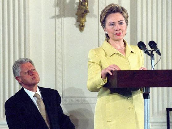Hillary Clinton Chairs White House Conference on Teens Washington, DC - May 2, 2000 -- First lady Hillary Rodham Clinton makes remarks as she convenes the White House Conference on Teenagers in the East Room of the White House in Washington, D.C. on Tuesday, May 2, 2000. The conference highlights the social and developmental importance of the teenage years. United States President Bill Clinton looks on from left. Credit: Ron Sachs CNP Washington District of Columbia United States of America EDITORIAL USE ONLY Copyright: xx Roll 4009, Frame 32 RonxSachsx cnpphotos010261