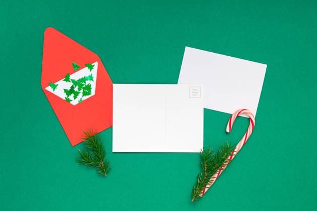 Christmas greetings letter mockup Creative New Year or Christmas greetings letter mockup flat lay top view Xmas holiday celebration envelope on green paper background. Template mock up greeting card or your text design 2019 2020 Copyright: xZoonar.com AnastasiaxZolotnitskayax 20834522