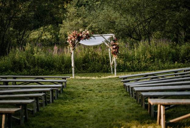 Wedding ceremony complete with arbor and flower arrangements. Scarborough, Maine, United States CR_SSNF240120C-1300166-01