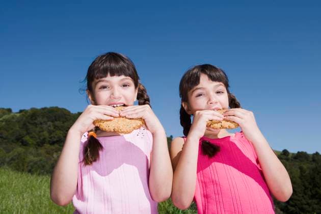 Young Hispanic sisters eating cookies outdoors Unknown, 21.12.2023, model released, TTBB_BLD027228.jpg, blue sky, bonding, cake, caucasian, childhood, clear sky, color image, cookie, copy space, day, eating, elementary age, enjoyment, family, food and drink, friend, friendship, front view, girl, holding, horizontal, humor, latin american and hispanic ethnicity, leisure activity, looking at camera, mixed race person, nature, only girls, outdoors, people, photography, portrait, posing, sister, sky, snack, summer, sunny, tasty, togetherness, treat, twin, two people, unity, waist up, young, minority, minorities2, amusing, baked goods, buddy, carbohydrate, child, children, chum, cloudless, color, colour, comedy, companion, companionship, comrad Copyright: xTanyaxConstantinex