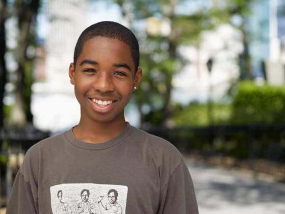 Smiling African teenage boy in urban park Brooklyn, NY, 21.12.2023, model released, TTBB_BLD064615.jpg, 12-13 years, african ethnicity, boy, city life, cityscape, close up, color image, confidence, day, front view, happy, head and shoulders, horizontal, independence, looking at camera, one boy only, one person, outdoors, park, people, photography, portrait, posing, positive, pre-adolescent child, smiling, standing, strength, urban, minority, minorities, gritafrican, african american, african-american, afro american, afro-american, black, bliss, cheerful, child, children, city, close-up, closeup, color, colour, confident, daylight, daytime, delight, delighted, energy, enjoyment, fellow, gaiety, glad, gleeful, gratifying, head & shoulders, h Copyright: xGrangerxWootzx