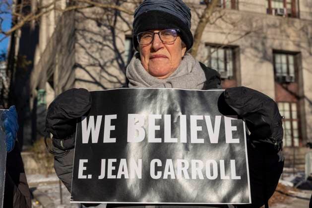 January 22, 2024, New York, New York, USA: Anti-Trump protesters with Rise & Resist hold signs outside of the U.S. District Courthouse as E. Jean Carroll and former President Donald Trump arrive for the defamation trial against Trump. .A person holds a sign that reads We Believe E. Jean Carroll. New York USA - ZUMAr174 20240122_znp_r174_008 Copyright: xGinaxMxRandazzox