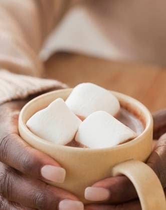 African woman holding cup of hot chocolate and marshmallows Jersey City, NJ, 21.12.2023, model released, TTBB_BLD073582.jpg, 40-44 years, african ethnicity, anticipation, beverage, close up, color image, comfort, comforting, copy space, drinking, enjoying, food and drink, holding, hot chocolate, indoors, indulgence, lifestyle, marshmallow, mature adult, melting, midsection, mug, one mature woman only, one person, people, photography, sweet, temptation, three objects, treat, unhealthy eating, vertical, warm, warming, winter, woman, minority, minorities40s, 40-45, 40-50, 40s, 45-50, 50-55, 50-60, 55-60, adult, african, african american, african-american, afro american, afro-american, allure, appreciating, black, cheering, close-up, closeup, Copyright: xJGI JamiexGrillx