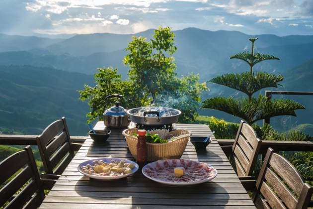 dinner with a Thai BBQ at sunset in the mountains of Thailand dinner with a Thai BBQ at sunset in the mountains of Doi Chang Chiang Rai Thailand Copyright: xZoonar.com FokkexBaarssenx 20857906