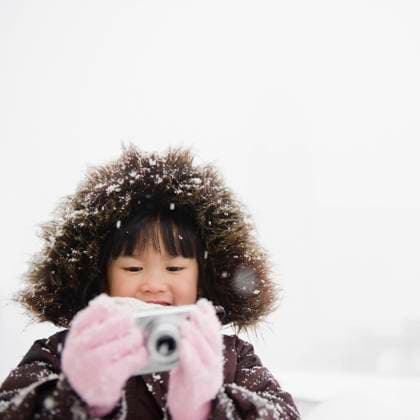 Chinese girl in snow using digital camera Jersey City, New Jersey, 21.12.2023, model released, TTBB_BLD079332.jpg, 6-7 years, arms outstretched, asian ethnicity, brunette, camera, childhood, chinese ethnicity, coat, cold, cold temperature, color image, copy space, day, digital camera, elementary age, enjoying, freezing, front view, fun, fur, fur hood, girl, glove, head and shoulders, holding, hood, looking down, low angle view, memories, memory, one person, outdoors, people, photographing, photography, single object, snow, snowing, square image, technology, warm clothing, winter, minority, minoritiesaccessory, apparel, appreciating, asian, brown hair, cap, child, children, chilly, clothes, clothing, color, colour, cool, daylight, daytime, Copyright: xJGI JamiexGrillx