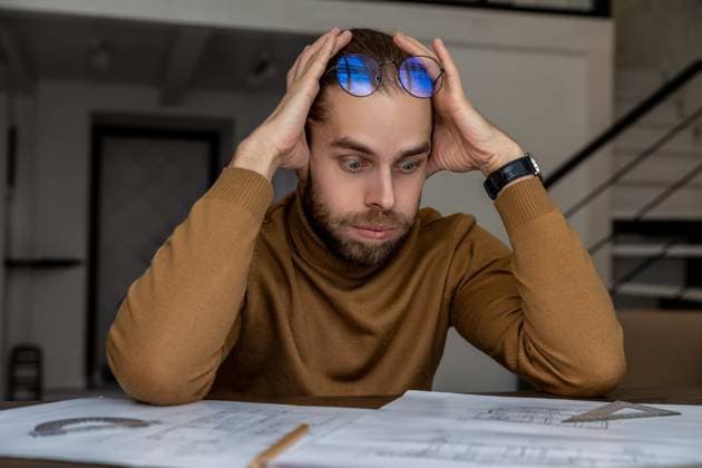 Exhausted tired engineer architect working on design of house, creating blueprint, being overworked. Exhausted tired young bearded young engineer architect working on new design of house, creating blueprint, being overworked. ,model released, Symbolfoto Copyright: xZoonar.com TYMOSHCHUKxANDRIYx 20886917 ,model released, Symbolfoto ,property released