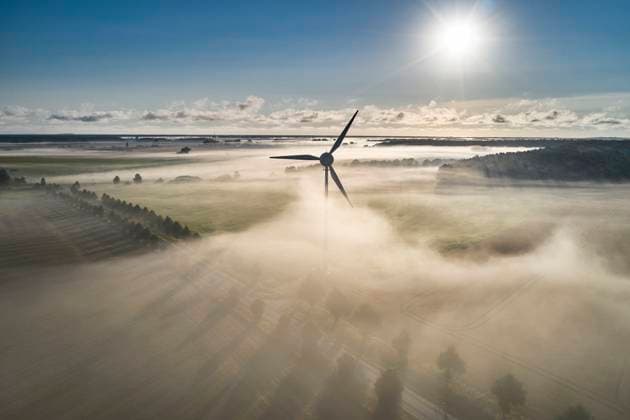 onshore wind turbine standing in fog in the morning sun onshore wind turbine standing in fog in the morning sun Copyright: xZoonar.com StefanxDinsex 20979965