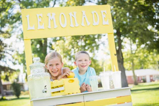 Caucasian brother and sister smiling at lemonade stand Lehi, Utah, USA, 17.09.2014, model released, TTBB_BLD142161.jpg, 4-5 years, 6-7 years, advertising, blonde hair, bonding, booth, boy, boys, brother, capitalism, caucasian, childhood, color image, commerce, consumerism, cup, day, earning, elementary age, enjoying, enterprise, entrepreneur, focus on foreground, food and drink, freshness, friend, front view, girl, girls, glassware, happy, head and shoulders, horizontal, initiative, innocence, leaning, lemon, lemonade, lemonade stand, lifestyle, merchandise, nature, offering, organic, outdoors, people, photography, pitcher, refreshing, retail, selling, sign, sister, small business, smiling, stand, standing, startup, straw, summer, sunny, s Copyright: xMikexKempx