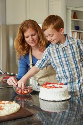 Caucasian mother and son decorating cake in kitchen Christiansburg, Virginia, USA, 07.04.2015, model released, TTBB_BLD158590.jpg, 40-44 years, 6-7 years, assistance, baking, bonding, boy, boys, cake, caucasian, childhood, choice, Christiansburg, color image, cooking, cooperation, decorating, dessert, domestic kitchen, domestic life, elementary age, family with one child, food and drink, happy, helping, indoors, learning, looking down, love, mature adult, mature women, mother, one parent, people, photography, red hair, selective focus, smiling, son, standing, strawberry, teaching, teamwork, together, two people, United States, vertical, Virginia, woman, working together, 2, 40-45, 40-50, 40s, 40s, 45-50, 50-55, 50-60, 55-60, adoring, adorn Copyright: xJeffxGreenoughx