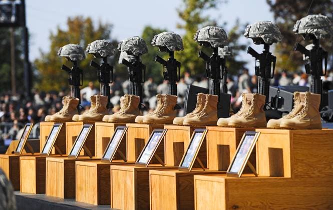 Memorial service for 13 killed and 30 wounded at Fort Hood shooting Fort Hood, TX - November 10, 2009 -- The Soldiers Cross, boots, rifles and helmets, sit on the podium at the memorial service for the 12 soldiers and one civilian killed at Fort Hood U.S Army Post near Killeen, Texas, USA 10 November 2009. Army Major Malik Nadal Hasan reportedly shot and killed 13 people, 12 soldiers and one civilian, and wounded 30 others in a rampage 05 November at the base s Soldier Readiness Center where deploying and returning soldiers undergo medical screenings. .Credit: Tannen Maury Pool via CNP Fort Hood Texas United States of America EDITORIAL USE ONLY Copyright: xx THM03P epa01928211 TannenxMauryx cnpphotos021508