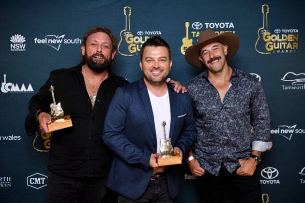 TAMWORTH COUNTRY MUSIC FESTIVAL 2024, Vocal Collaboration of the Year winners The Wolfe Brothers with Travis Collins (centre) pose for a photograph at the Golden Guitar Awards during the 52nd Tamworth Country Music Festival in Tamworth, New South Wales, Saturday, January 27, 2024. The biggest music festival in the country returns, with the 52nd Golden Guitar awards to be announced. ( NO ARCHIVING, EDITORIAL USE ONLY, NO USE IN BOOKS WITHOUT CONSENT TAMWORTH NEW SOUTH WALES AUSTRALIA  Copyright: xBIANCAxDExMARCHIx 20240127001894211790