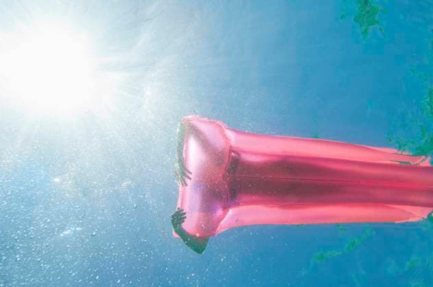 Underwater view of woman sunbathing on raft in ocean Stintino, Sassari, Italy, 21.12.2023, model released, TTBB_BLD170656.jpg, 45-49 years, adventure, authentic, authenticity, calm, carefree, caucasian, color image, copy space, day, enjoying, floating, freedom, full length, fun, getting away from it all, happy, high angle view, horizontal, inflatable mattress, inflatable raft, italy, journey, lake, laying, laying down, leisure activity, lifestyle, mature adult, mature women, ocean, one person, outdoors, peace, people, photography, pink, pool raft, raft, real people, recreation, relaxation, sardinia, sassari, serene people, serenity, silhouette, stintino, summer, sun, sunbathing, sunlight, sunny, swimming, tranquil scene, tranquility, trave Copyright: xAlbertoxGuglielmix