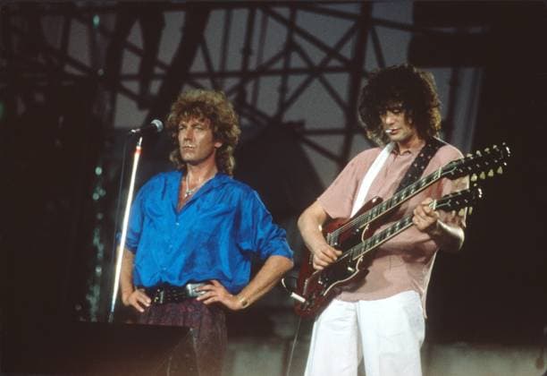 Robert Plant Jimmy Page at LIVE AID concert 1985 Robert Plant Jimmy Page at LIVE AID concert John Barrett PHOTOlink. EDITORIAL USE ONLY Copyright: xx PhotoxByxJohnxBarrett PHOTOlink.x phlphotos416629