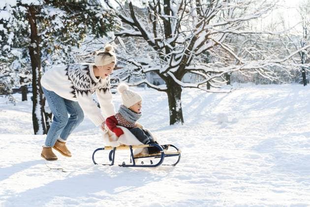 Mother and her cute little son having on a sledding hill during sunny winter day Mother and her cute little son wearing warm sweaters are having on a sledding hill during sunny winter day ,model released, Symbolfoto Copyright: xZoonar.com blackdayx 21036197 ,model released, Symbolfoto ,property released