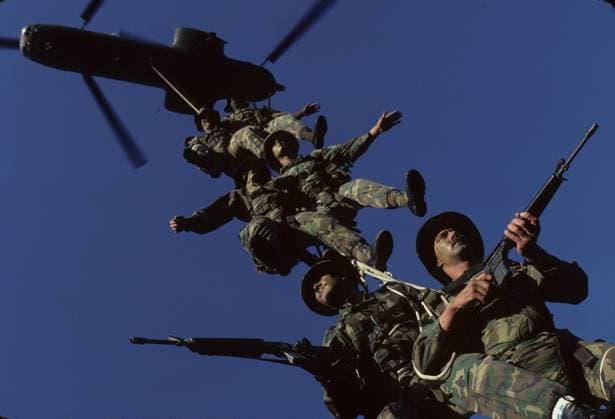 SPIE rig Marines rehearch a SPIE extraction for an ad for J. Walter Thompson. FYI. I had them doing this for so long that the Marine close to the top passed out--Scared the heck out of me. Photograph by Dennis Brack bb 27 Camp Pendleton CA USA EDITORIAL USE ONLY Copyright: xx x bsphotos035400