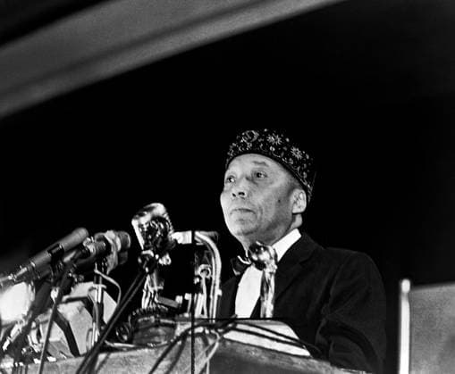 December 15, 2023, USA: Elijah Muhammad standing behind microphones at podium, Stanley Wolfson, New York World-Telegram and the Sun Newspaper Photograph Collection, 1964 USA - ZUMAg145 20231215_zap_g145_006 Copyright: xJTxVintagex