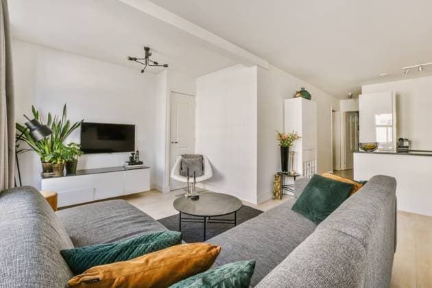 An elegantly designed living space showcasing a contemporary sofa, sleek entertainment unit, and minimalist accents. Model Released ProCreators_ID5222_167835_005 Copyright: xProxCreatorsx RECORD DATE NOT STATED