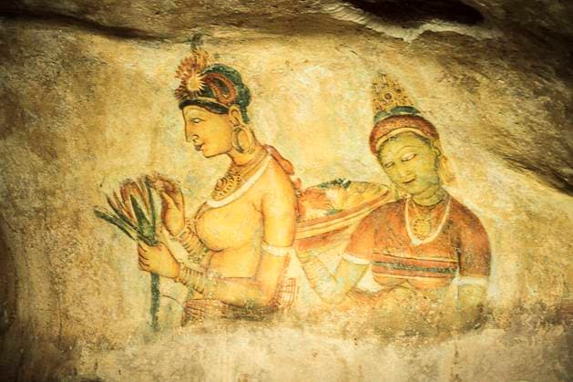 Ancient famous wall paintings at Sigirya in Sri Lanka Wall painting (frescoes) in Sigiriya an ancient rock fortress , Apsara celestial nymphs - ancient painting on the walls in the Lion Rock cave, Sigiriya, Sri Lanka Copyright: xZoonar.com GiampaoloxCianellax 18580019
