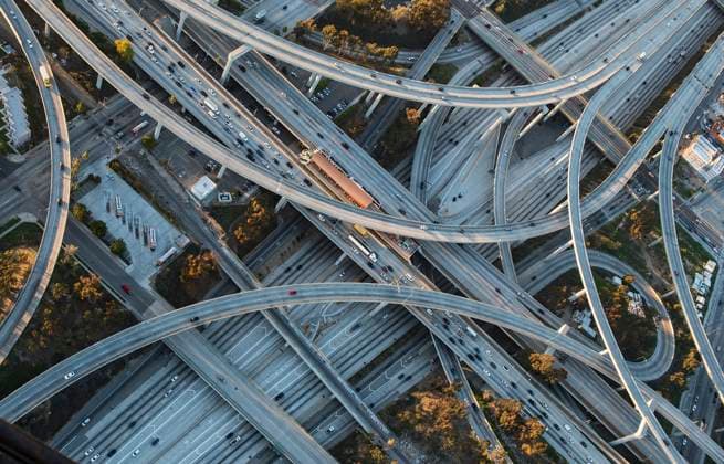 Aerial view of highway interchange in cityscape Los Angeles, California, USA, 21.12.2023, TTBB_BLD222758.jpg, aerial view, backgrounds, california, car, cityscape, color image, commuting, confusion, congestion, day, directly above, driving, freeway, full frame, high angle view, highway, horizontal, infrastructure, interchange, intertwined, large group of objects, los angeles, modern, nobody, on the move, outdoors, overpass, photography, spaghetti junction, the way forward, traffic, transportation, travel, united states, urban, vehicle, droneaerial, america, american, americas, auto, automobile, birds eye view, birds-eye view, ca, carriageway, city, color, colour, contemporary, current, daylight, daytime, driver, flyover, from above, group, Copyright: xChrisxSattlbergerx