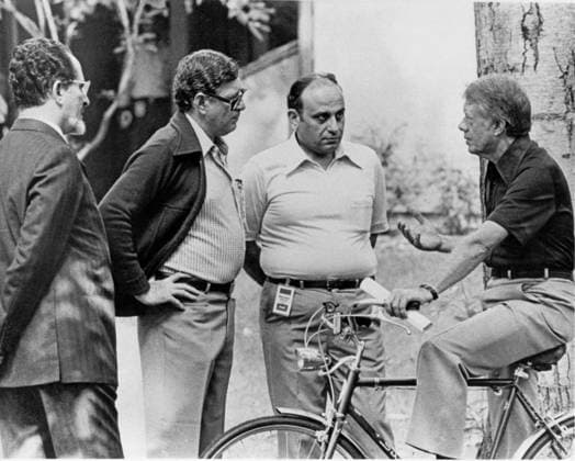 Egypt - Israel Summit at Camp David United States President Jimmy Carter, right, interrupts a ride on his bicycle to speak with Foreign Minister Muhammad Ibrahim Kamal of Egypt, left, Deputy Premier Hassan Tohami of Egypt, left center, and Ahmed Maher El Sayed, advisor to FM Kamal at Camp David, near Thurmont, Maryland on September 12, 1978..Credit: White House via CNP Thurmont Maryland United States of America EDITORIAL USE ONLY Copyright: xx WA-6046 WhitexHousex cnpphotos030770