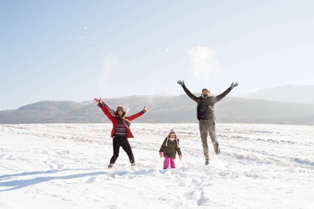 Father and mother with their daughter, playing in the snow. Father and mother having fun with their daughter, playing in the snow. Sunny white winter nature. model released Copyright: xx Win fam Povodovci_200
