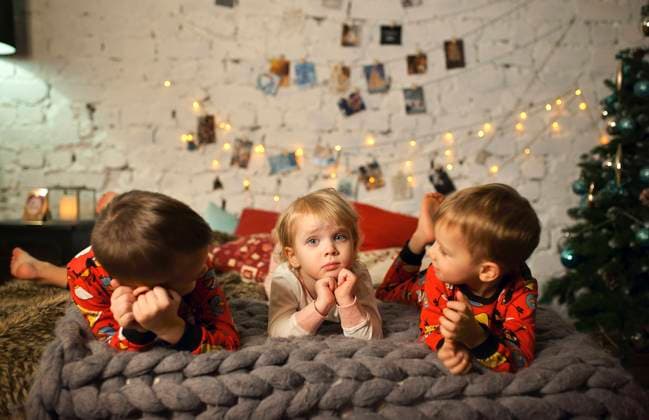 Caucasian girls and boy laying on bed near Christmas tree Novosibirsk, Novosibirskaya oblast, Russia, 21.12.2023, model released, TTBB_BLD250108.jpg, 2-3 years, 6-7 years, authentic, authenticity, bed, bedroom, blanket, bonding, boy, boys, brother, candid, caucasian, celebration, childhood, christmas, christmas tree, color image, elementary age, festive, front view, gen z, generation z, girl, girls, hand on chin, head and shoulders, holiday, horizontal, indoors, laying, listening, night, novosibirsk, novosibirskaya oblast, pajamas, people, photography, preschooler, real life, real people, russia, sister, string lights, talking, three people, together, tradition, waiting, 3, after dark, apparel, asia, asian, celebrating, chatting, cheerful, Copyright: xValeriyaxTikhonovax