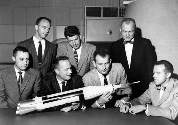 Original 7 Astronauts The Original 7 Mercury Astronauts are pictured around a table admiring an Atlas model on April 30, 1959. Standing, left to right are Alan B. Shepard, Jr., Walter M. Schirra, Jr., and John H. Glenn, Jr.; sitting, left to right are Virgil I. Grissom, M. Scott Carpenter, Donald Slayton, and L. Gordon Cooper, Jr. The Mercury 7 astronauts were introduced to the American public in April 1959. The seven criteria for selection were as follows: 1. less than 40 years old; 2. less than 5 foot 11 inches tall: 3. excellent physical condition; 4. bachelor s degree in engineering or equivalent; 5. test-pilot school graduate; 6. minimum of 1,500 hours flying time; 7. qualified jet pilot. However, the process of choosing the first as Copyright: xx S62-02704 EL-1996-00070 108758 NASAx cnpphotos032500