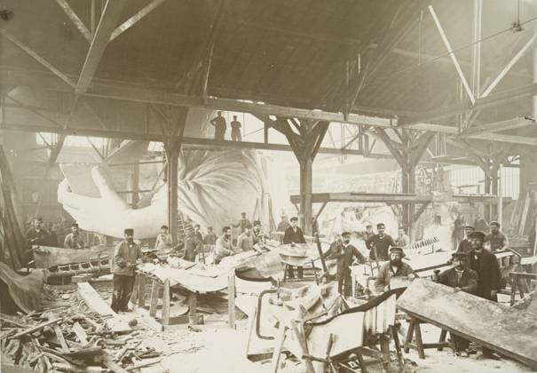 Men in a workshop hammering sheets of copper for the construction of the Statue of Liberty, 1883 (albumen print) 1129468 Men in a workshop hammering sheets of copper for the construction of the Statue of Liberty, 1883 (albumen print) by Fernique, Albert (d.1898); New York Public Library, USA; (add.info.: The statue, designed by FrÃ dÃ ric Auguste Bartholdi and dedicated on October 28, 1886, was a gift to the United States from the people of France.). Copyright: xBridgemanxImagesx 1129468