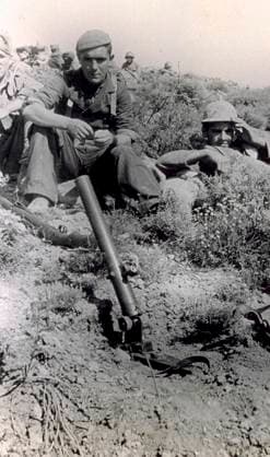National Spanish soldier photographed on July 13, 1938. Next to him are other soldiers. He is seated on the ground with a rifle leaning up before him and with a Spanish assault mortar in the foreground (b w photo) 1250016 National Spanish soldier photographed on July 13, 1938. Next to him are other soldiers. He is seated on the ground with a rifle leaning up before him and with a Spanish assault mortar in the foreground (b w photo) by Unknown photographer, (20th century); (add.info.: Unidentified Author Spain); Fratelli Alinari Museum Collections, Florence, Italy. Copyright: xFratellixAlinarixMuseumxCollections,xFlorence,xItalyx xBridgemanxImagesx 1250016