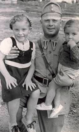Portrait of a soldier in uniform holding two children in his arms. The little girl is smiling, while her younger brother has his hand on his mouth and looks very serious, 1938 Spain (b w photo) 1250087 Portrait of a soldier in uniform holding two children in his arms. The little girl is smiling, while her younger brother has his hand on his mouth and looks very serious, 1938 Spain (b w photo) by Unknown photographer, (20th century); (add.info.: Unidentified Author Spain); Fratelli Alinari Museum Collections, Florence, Italy. Copyright: xFratellixAlinarixMuseumxCollections,xFlorence,xItalyx xBridgemanxImagesx 1250087