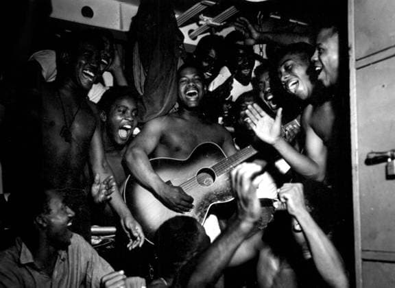 African-American Soldier Celebrating the Japanese Surrender, USS Ticonderoga, 14th August 1945 (b w photo) 1720227 African-American Soldier Celebrating the Japanese Surrender, USS Ticonderoga, 14th August 1945 (b w photo) by American Photographer, (20th century); (add.info.: On U.S.S. Ticonderoga, African-Americans soldiers celebrating surrender of Japan august 14, 1945). Copyright: xBridgemanxImagesx 1720227