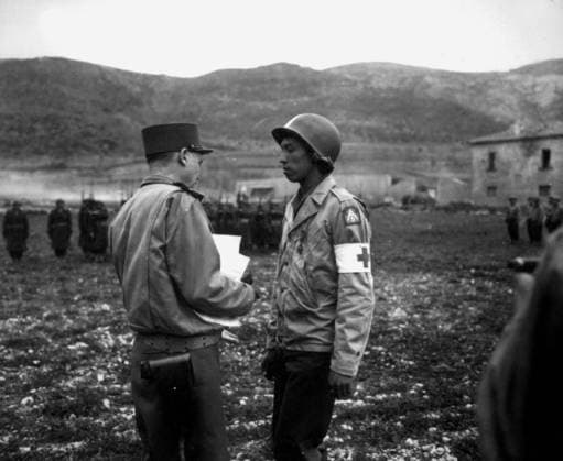 Private Jonathan Hoag is awarded the Croix de Guerre by French General Alphonse Juin, Italy, 21st March, 1944 1721276 Private Jonathan Hoag is awarded the Croix de Guerre by French General Alphonse Juin, Italy, 21st March, 1944 by Unknown photographer, (20th century); (add.info.: Pvt. Jonathan Hoag is awarded the Croix de Guerre by french general Alphonse Juin, Commanding General of the FEC, for courage shown in treating wounded, near Pozzuoli, Italy, march 21, 1944). Copyright: xBridgemanxImagesx 1721276